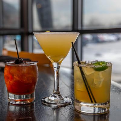 Three cocktails on display.