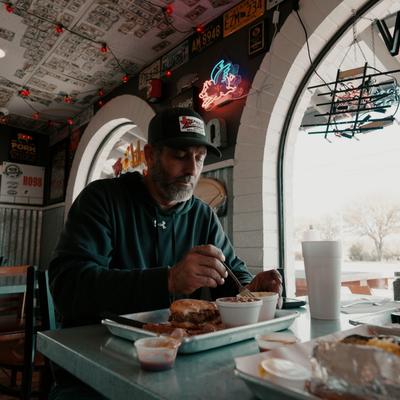 Person having food at the table.