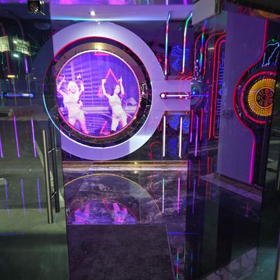 Neon-lit entrance area for a karaoke venue.