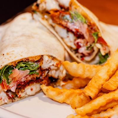 Chicken Bacon Ranch Wrap served with crinkle-cut fries.