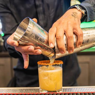 Professional bartenders yearning to make you a delicious cocktail.