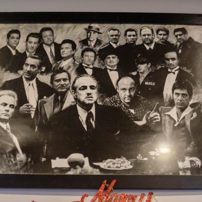 Black and white collage print featuring characters from classic mob movies.
