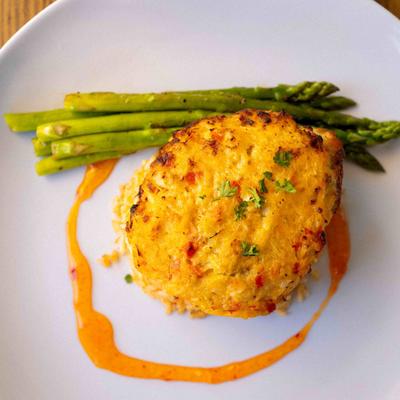 Crab Topped Mahi Mahi with pilaf and asparagus.