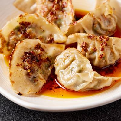 Chili Oil Pan - Fried Pork Dumplings, close up.