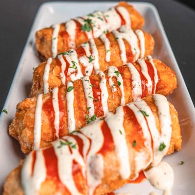Spicy buffalo rolls topped with sauce