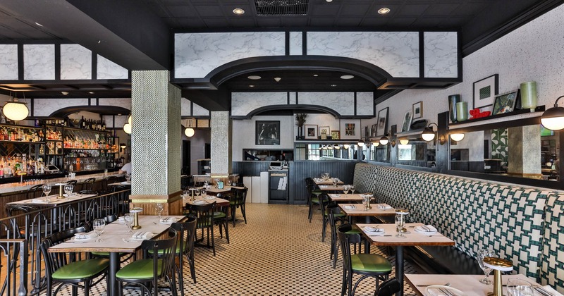Interior seating area with booths, chairs and tables