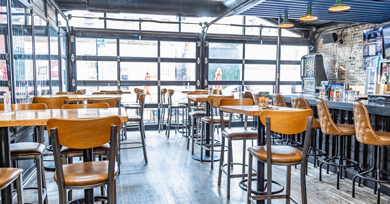 Interior, seating area with bar tables and bar stools