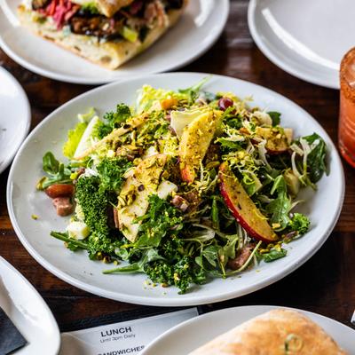 Honeycrisp salad plate surrounded by various food plates.