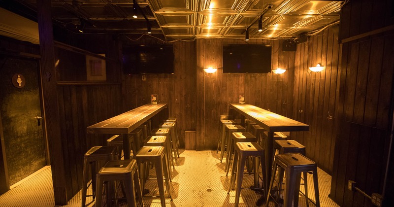 Interior, two long narrow tables with bar stools