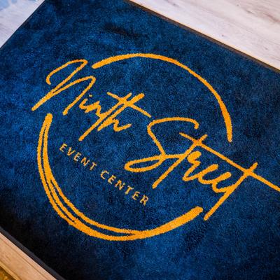 Ninth Street Event Center Logo mat. Gold and Black.