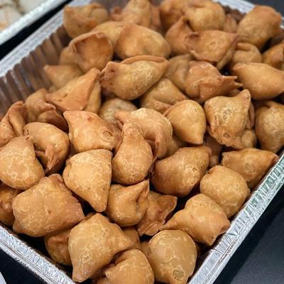 Samosas in a catering tray