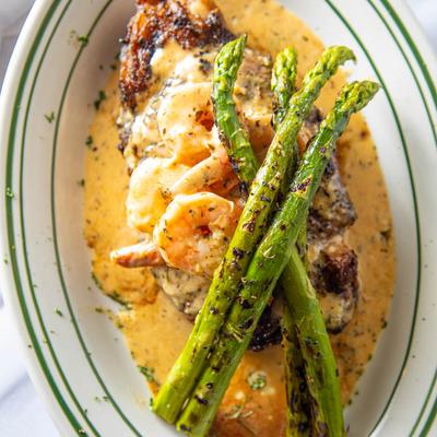 16 oz grilled Ribeye topped with Rips BBQ Shrimp.