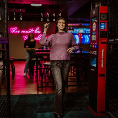 Girl throwing an axe.