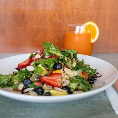 Salad with nuts, berries, and greens.