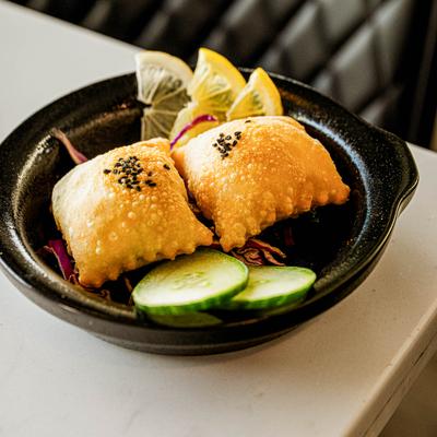 Two pieces of crispy Cheese Burak.