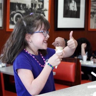 customer giving thumbs up for ice cream cones.