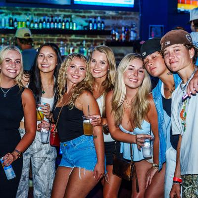 Lots of guests standing together.