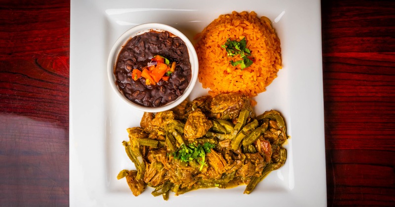 Pork in tomatillo sauce with beans and rice on the side