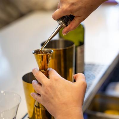 Bartender preparing a cocktail.
