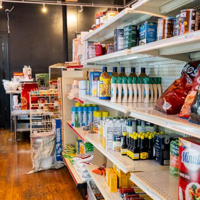 Shelves with various goods for sale.