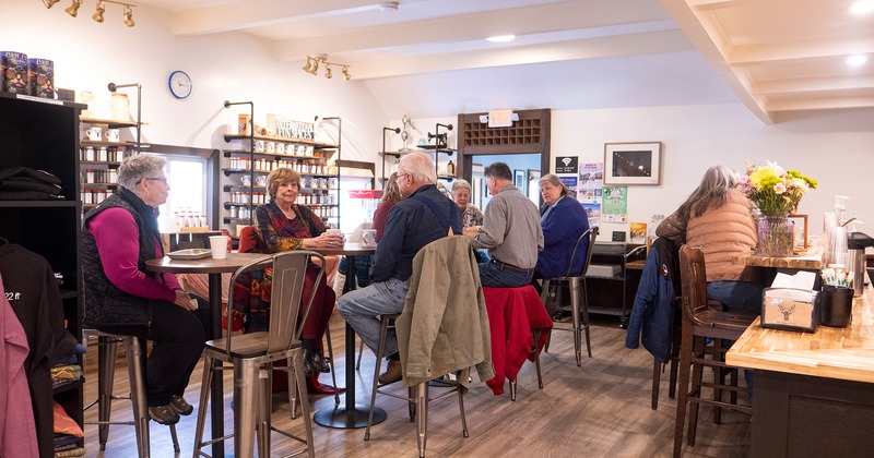 Interior space, seating area, guests chatting and enjoying their food and drinks