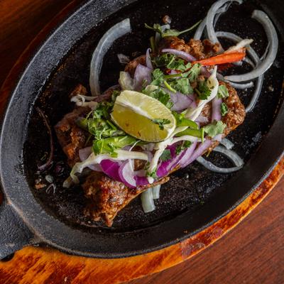 Beef Seekh Kebab, with onions, peppers, herbs, and spices.