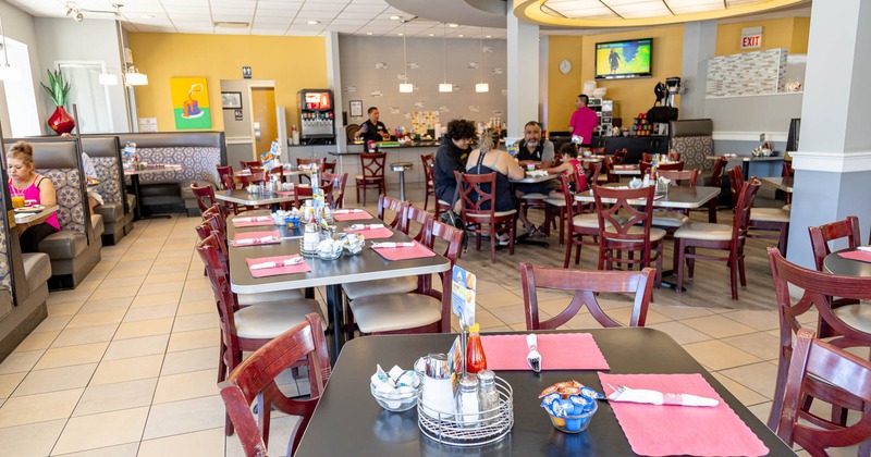 Interior, tables and guests enjoying lunch