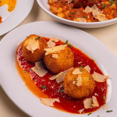 Risotto balls in tomato sauce