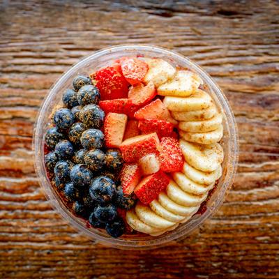 Acai Bowl, with bananas, strawberries, and blueberries.