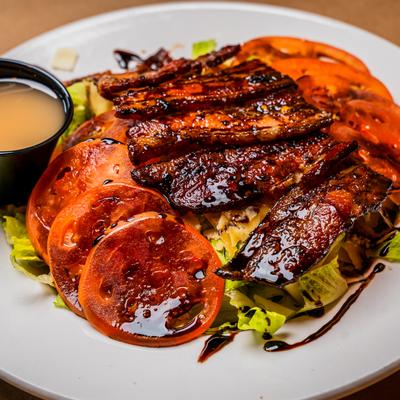 Oak & Embers BLT Salad with balsamic glaze.