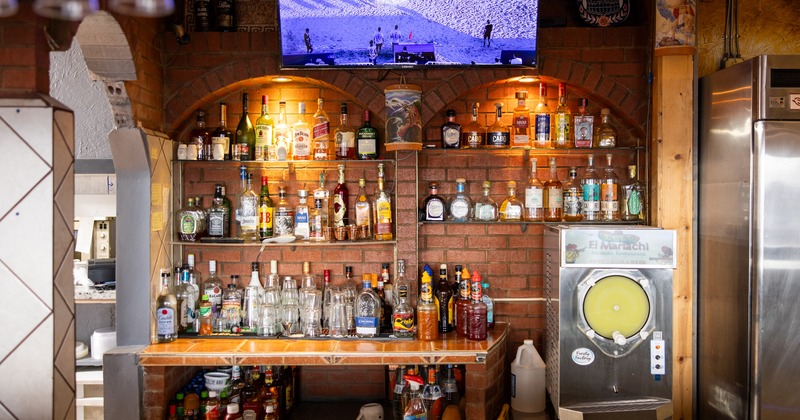 Bar, drink rack, tv screen, front view