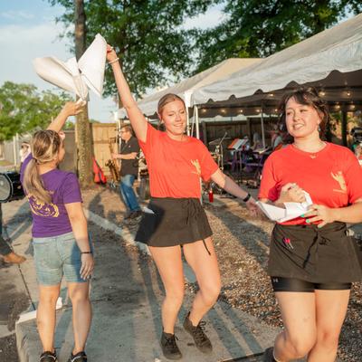 Outside, people dancing to the sounds of a brass band.