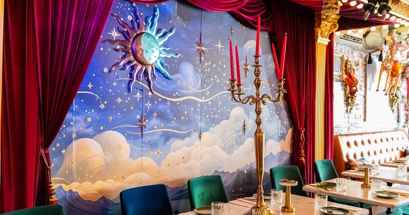 Interior, theater looking dining area, painted walls and a large candlestick