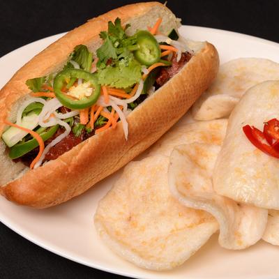 Barbecue pork sandwich with veggies.