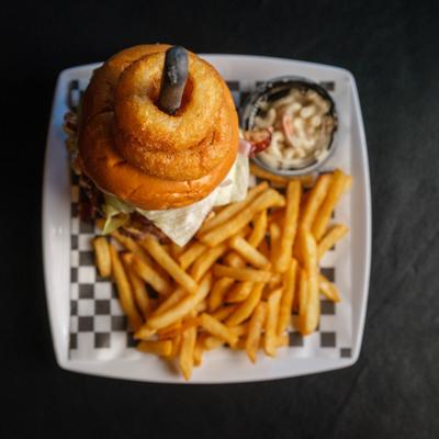 Big louie burger topped with onion rings, served with fries and coleslaw.