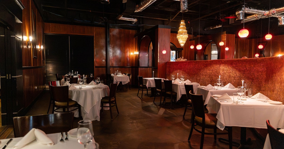 Elegant restaurant dining room with set dining tables