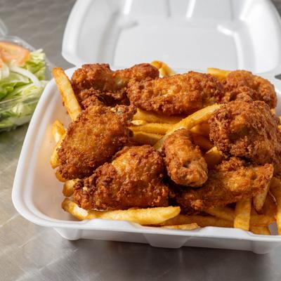 Fried chicken wings and fries.