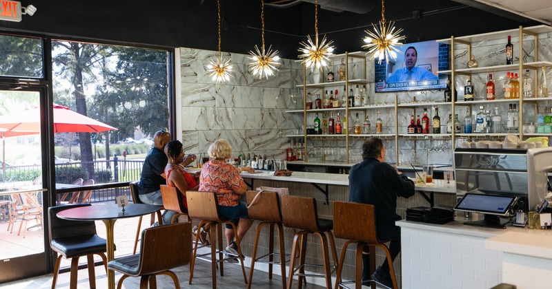 Interior, bar, guests, tv screen above