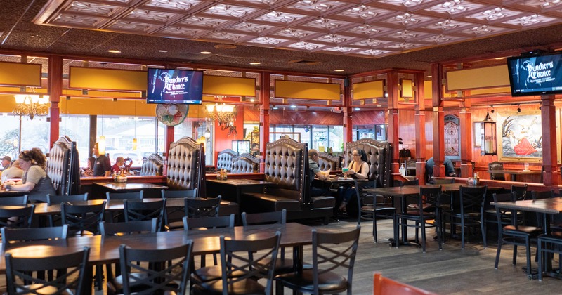 Interior, tables, chairs and sitting booths ready for guests