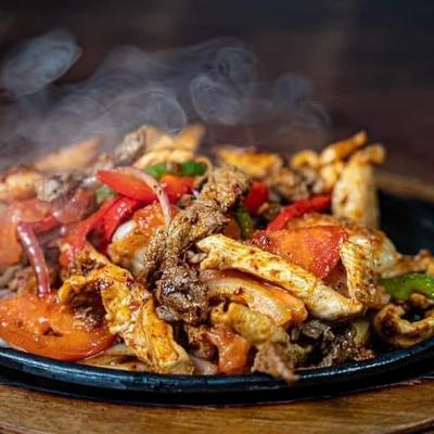 Fried salad with meat and veggies.