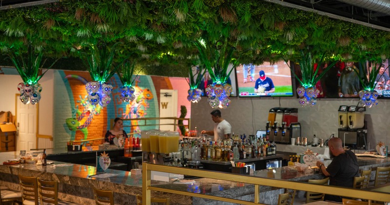 Bar area, bartender, wide view, tv screen above