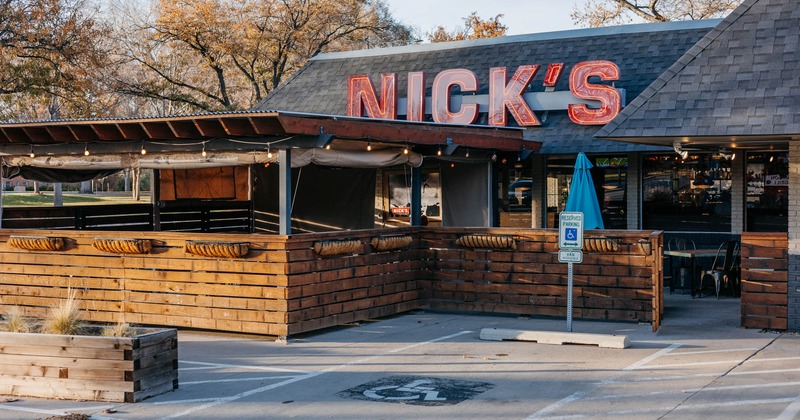 Exterior, front view to restaurant, part of parking lot