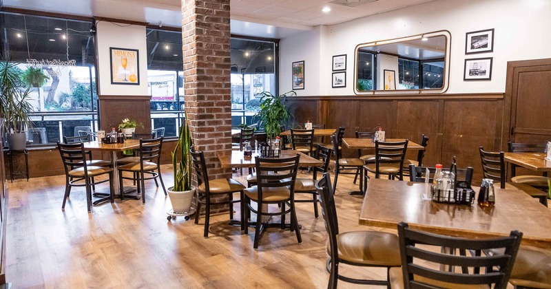 Interior, dining area with large windows in the back