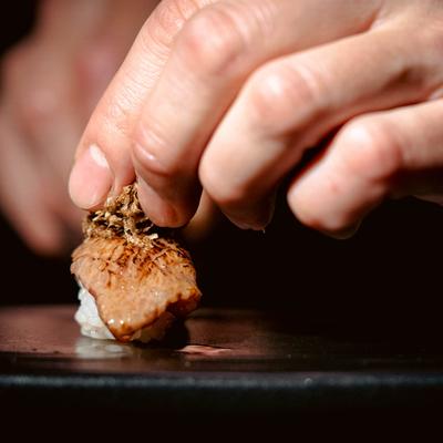 Hands preparing food.