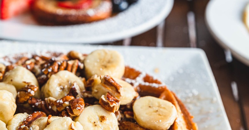 Banana Foster Waffle with pecans and rum sauce, closeup