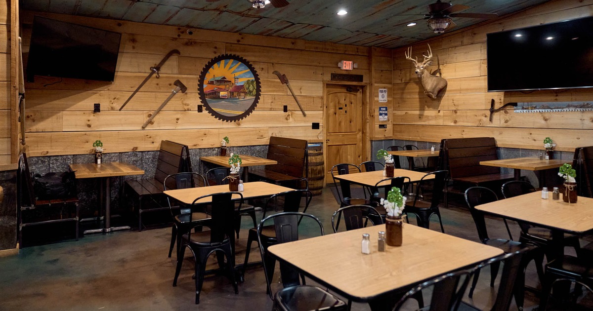 Interior, seating area, seating booths with wooden top tables, regular tables for four