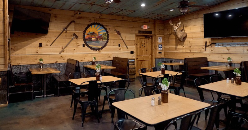 Interior, seating area, seating booths with wooden top tables, regular tables for four