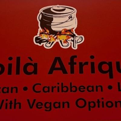 A red sign with the restaurant's name and logo