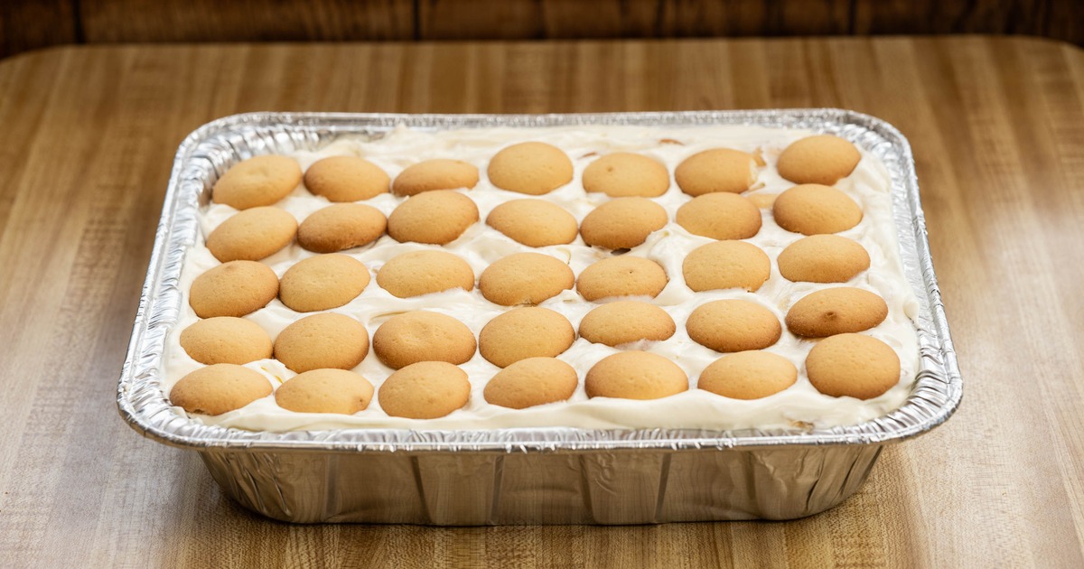 Banana Pudding topped with vanilla wafers and served in a foil pan