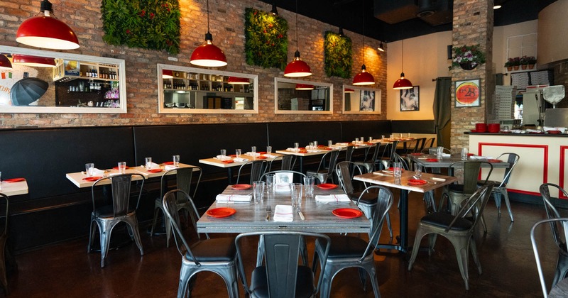 Interior, wide view of dining area, tables and chairs ready for guests